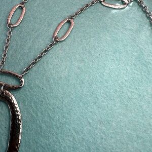 Designer long silver necklace w/tassel pre-owned
